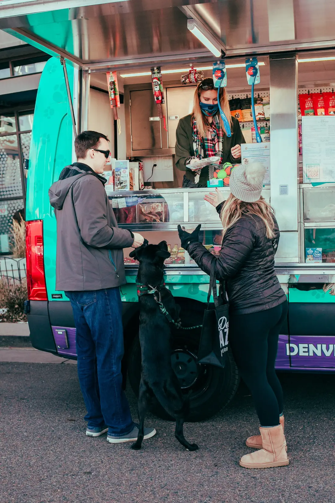 Ordering at the food truck with the dog in tow, Belleview Station Holiday BAZAAR.