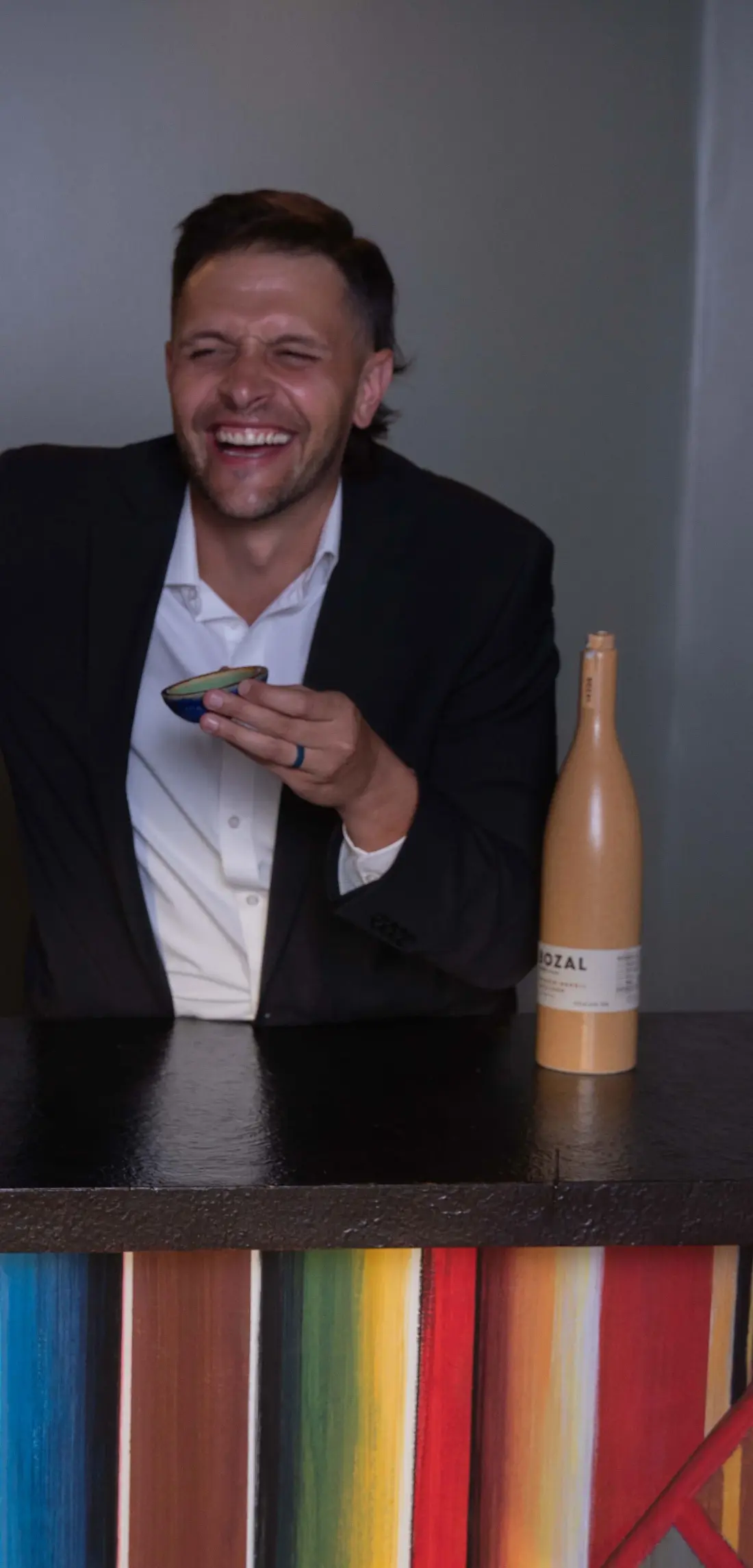 The blog’s author, holding a drink at a market.