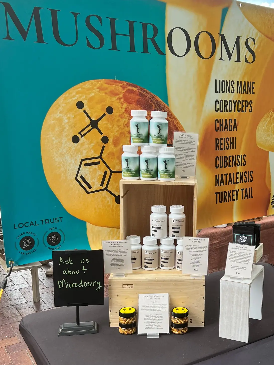 A display of mushroom supplement bottles beneath a Mushrooms banner.