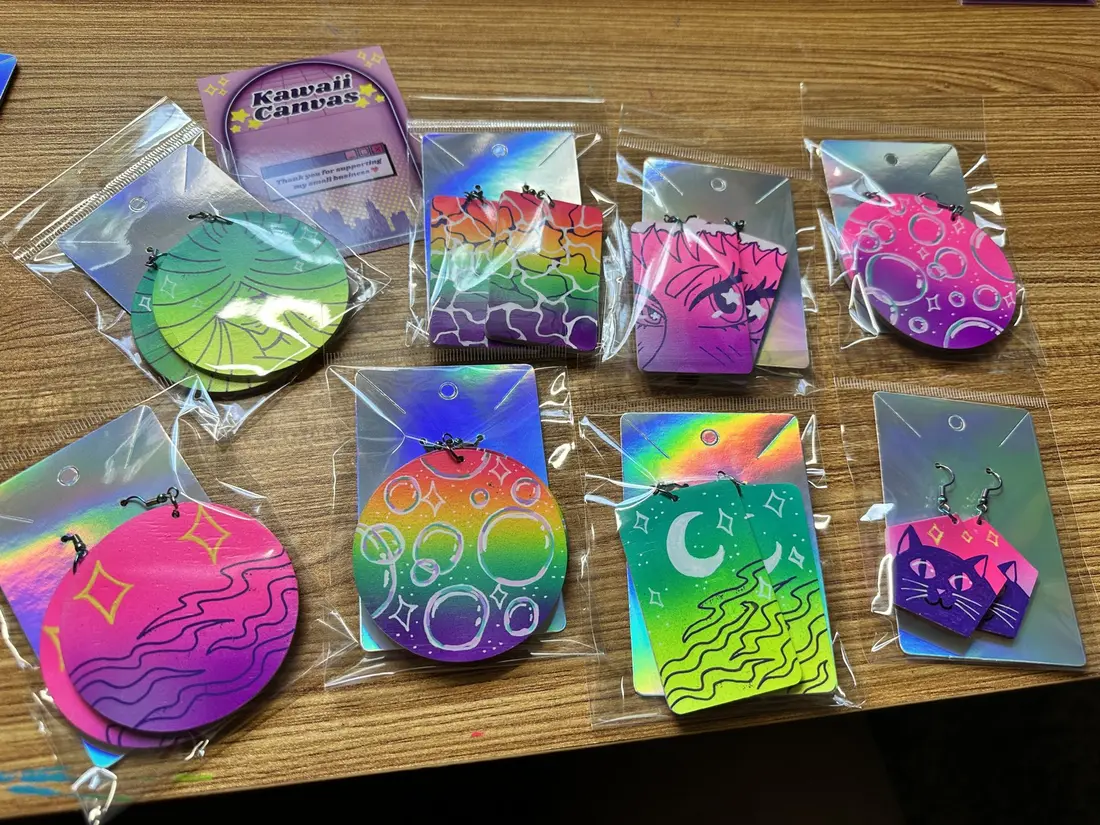 Airbrushed pastel pieces with stars and moons laid out on a table in packaging.