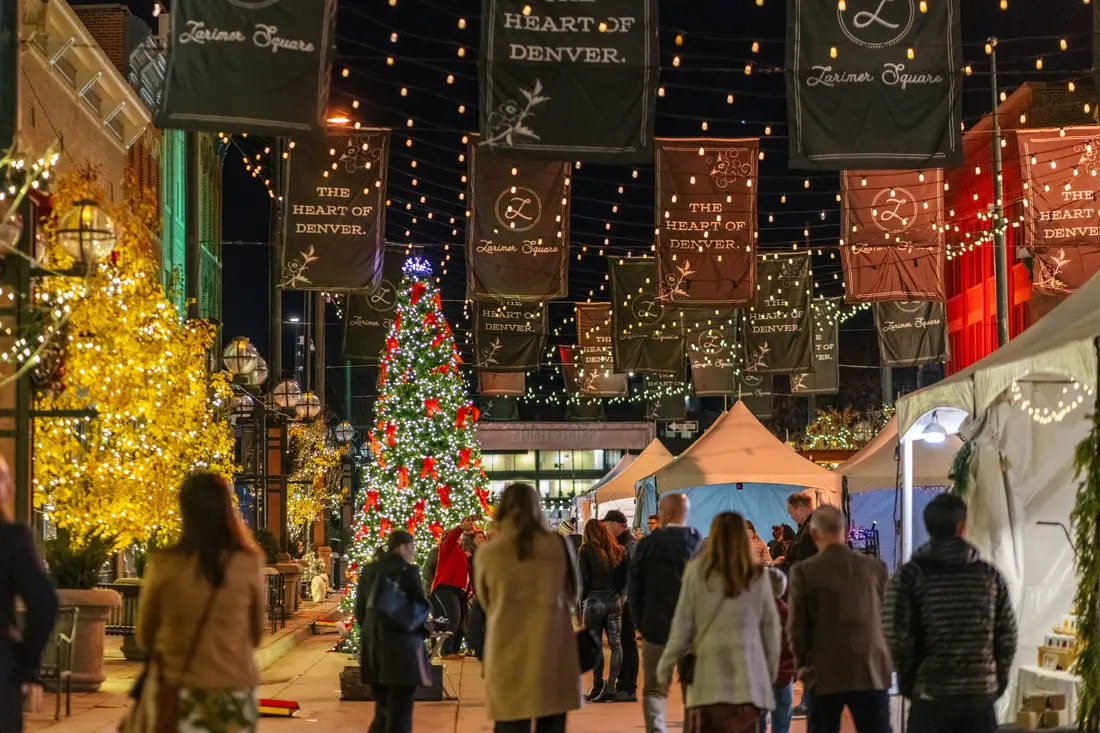 Larimer Square at the Holiday BAZAAR, 2024: a lit tree, string lights over the block, tents down the street.
