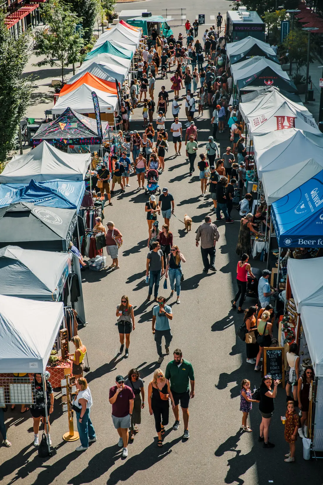 Sloan’s Lake from above: two rows of tents and the crowd walking between them.