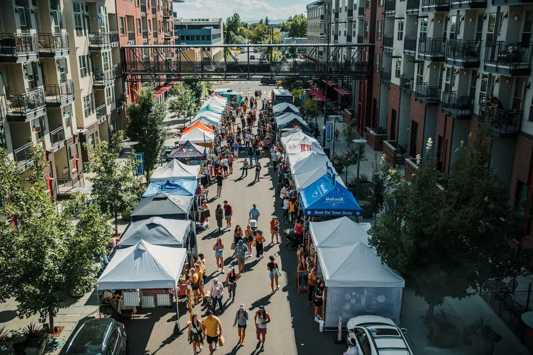 Sloan’s Lake Fall BAZAAR seen from above, tents lining the street.